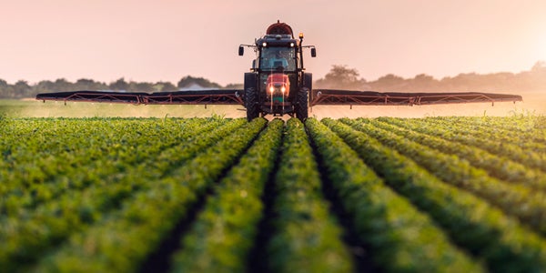 tractor plowing farm field